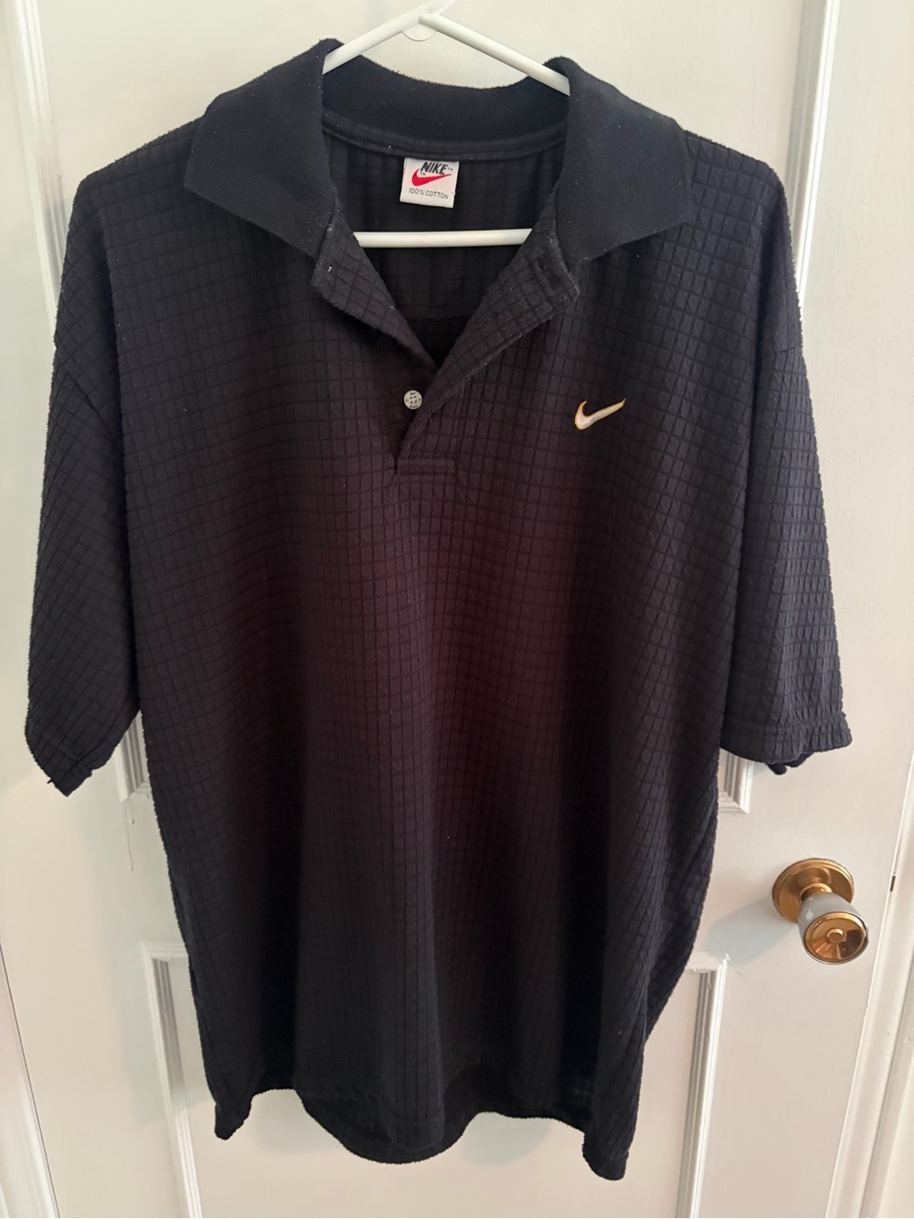Nike Men’s Black Polo with Gold Swoosh Accent